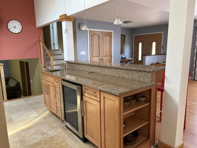 9842 S 88th Ave, Palos Hills, IL 60465 - kitchen featuring beverage cooler, dark stone counters, decorative light fixtures, brown cabinetry, and open shelves