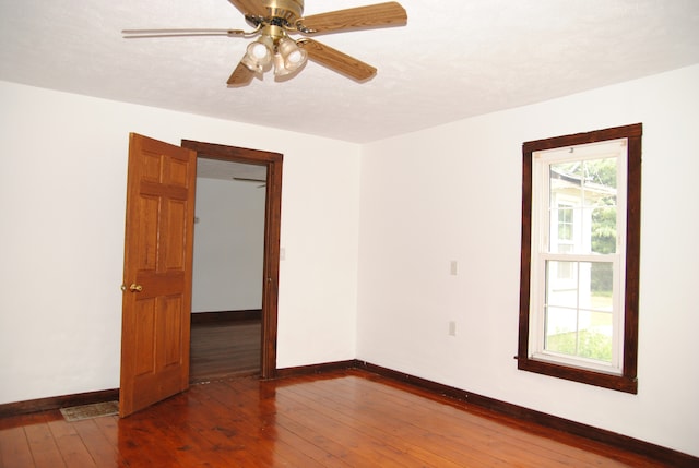 2840 W Ziebarth Rd, Normal, IL 61761 - unfurnished room featuring wood-type flooring and ceiling fan