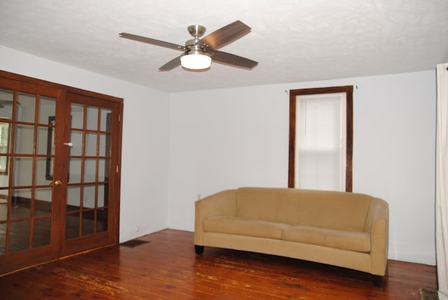 2840 W Ziebarth Rd, Normal, IL 61761 - sitting room featuring hardwood / wood-style floors, french doors, a ceiling fan, and a textured ceiling