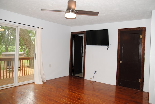 2840 W Ziebarth Rd, Normal, IL 61761 - unfurnished bedroom featuring hardwood / wood-style flooring, access to outside, a textured ceiling, and a ceiling fan