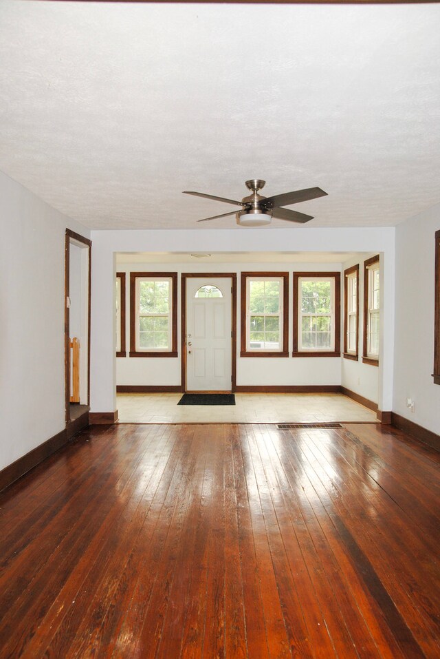 2840 W Ziebarth Rd, Normal, IL 61761 - unfurnished living room featuring ceiling fan and hardwood / wood-style flooring