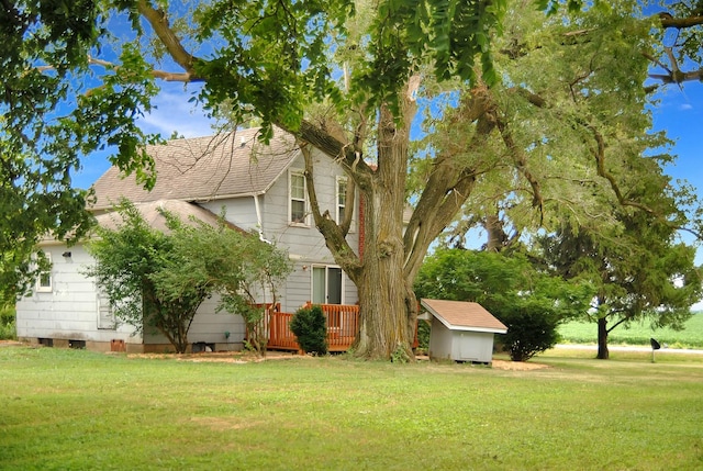 2840 W Ziebarth Rd, Normal, IL 61761 - view of grassy yard with a storage unit and a wooden deck