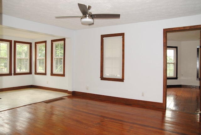 2840 W Ziebarth Rd, Normal, IL 61761 - spare room featuring hardwood / wood-style floors, plenty of natural light, and a ceiling fan