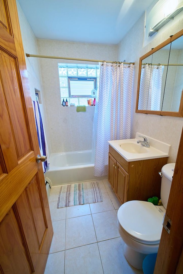 4444 N Central Ave Unit 2W, Chicago, IL 60630 - bathroom featuring shower / tub combo with curtain, vanity, and tile patterned flooring