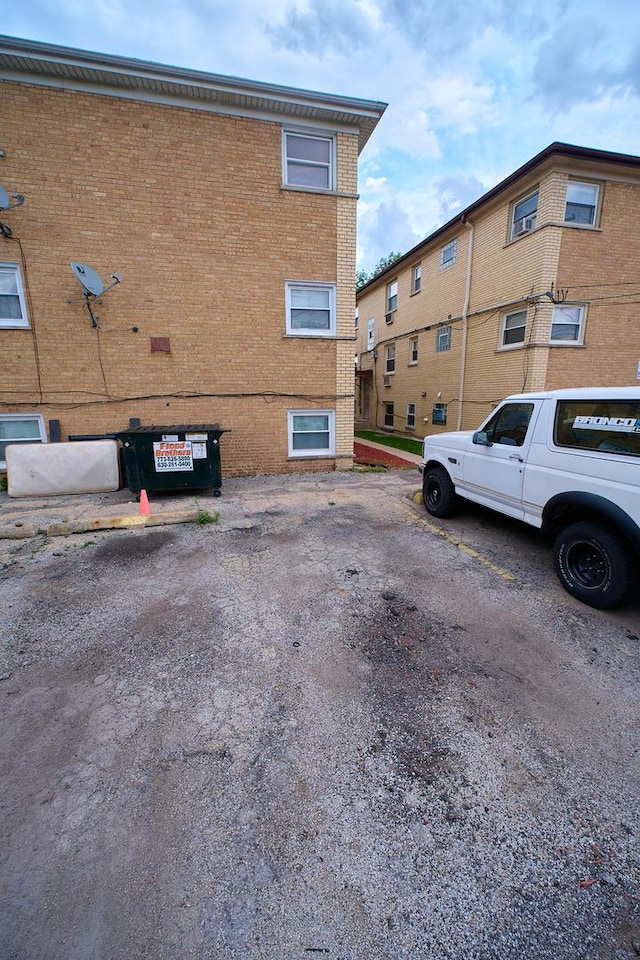 4444 N Central Ave Unit 2W, Chicago, IL 60630 - view of building exterior featuring uncovered parking