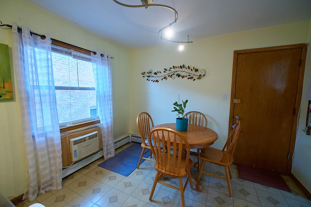 4444 N Central Ave Unit 2W, Chicago, IL 60630 - dining area featuring an AC wall unit and track lighting