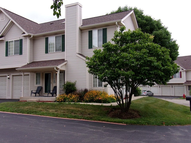 570 Windsor Dr Unit 570, Fox Lake, IL 60020 - multi unit property with a chimney, a porch, roof with shingles, and a front lawn