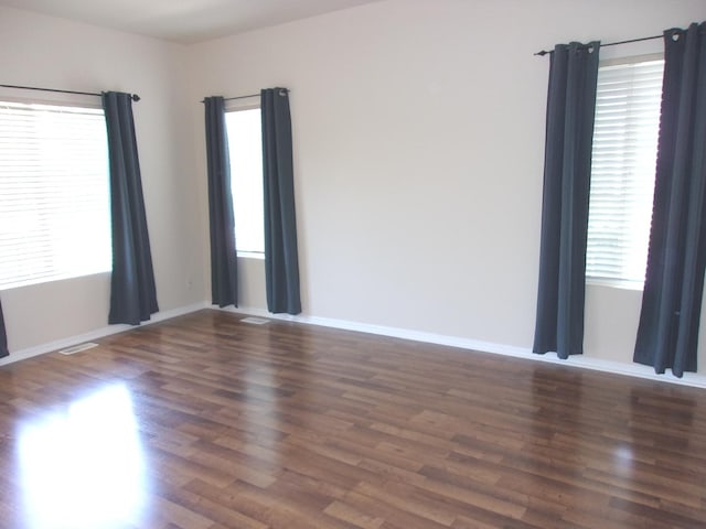 570 Windsor Dr Unit 570, Fox Lake, IL 60020 - unfurnished room featuring healthy amount of natural light and wood finished floors