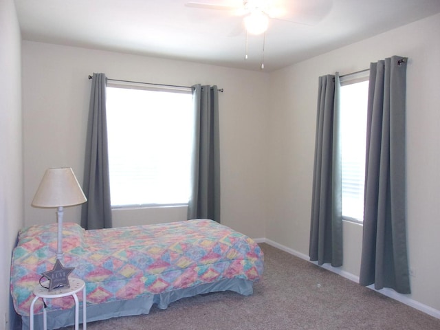 570 Windsor Dr Unit 570, Fox Lake, IL 60020 - bedroom with multiple windows, carpet, and ceiling fan