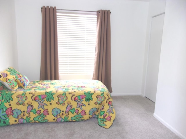 570 Windsor Dr Unit 570, Fox Lake, IL 60020 - carpeted bedroom featuring baseboards