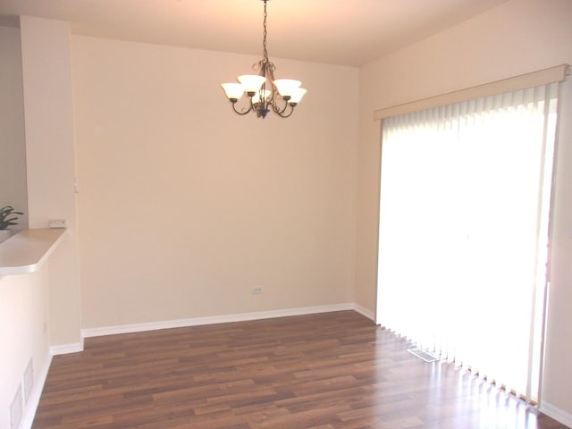 570 Windsor Dr Unit 570, Fox Lake, IL 60020 - unfurnished dining area with a chandelier and dark wood-style floors