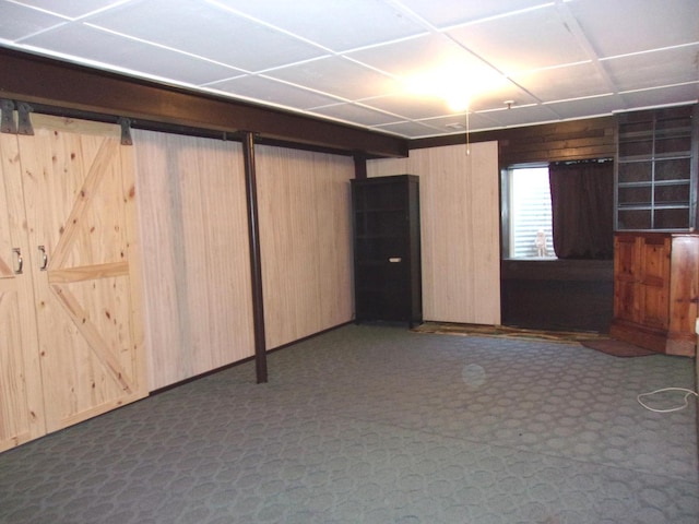 570 Windsor Dr Unit 570, Fox Lake, IL 60020 - basement featuring wooden walls and dark colored carpet