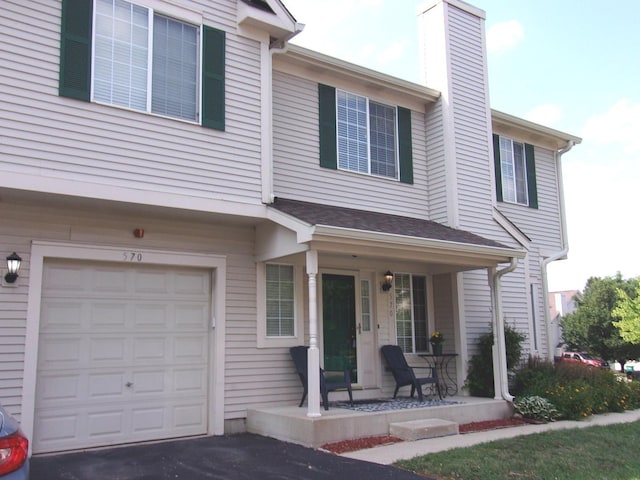 570 Windsor Dr Unit 570, Fox Lake, IL 60020 - multi unit property featuring a porch, an attached garage, and a chimney