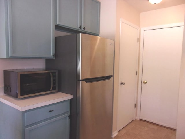 570 Windsor Dr Unit 570, Fox Lake, IL 60020 - kitchen with stainless steel appliances, gray cabinetry, light countertops, and light tile patterned flooring
