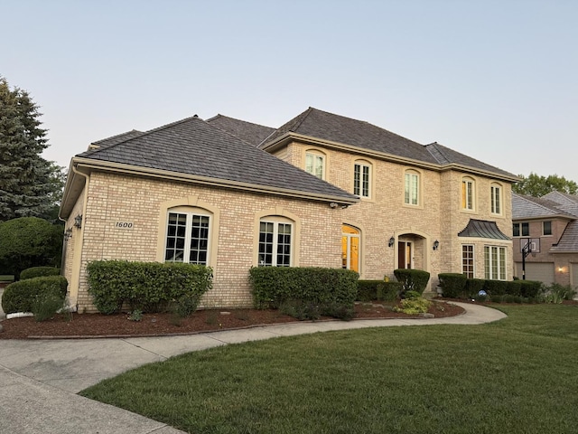 1600 Elderberry Dr, Libertyville, IL 60048 - view of front facade featuring a front yard and brick siding