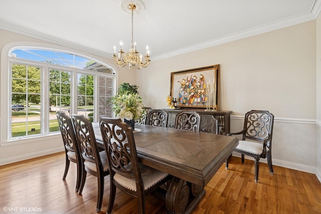 1600 Elderberry Dr, Libertyville, IL 60048 - dining room featuring a chandelier, healthy amount of natural light, wood finished floors, and crown molding