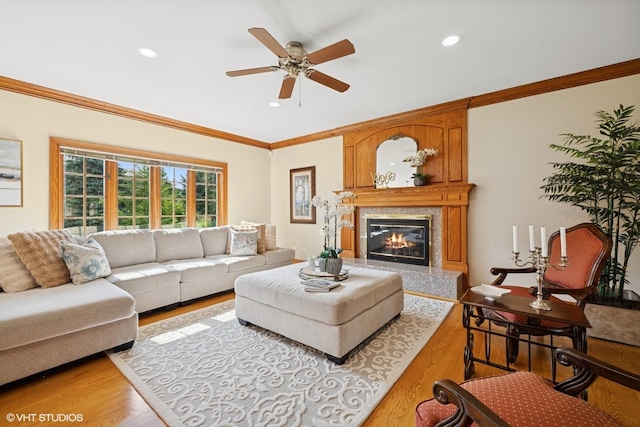1600 Elderberry Dr, Libertyville, IL 60048 - living room with crown molding, light wood-style flooring, recessed lighting, a ceiling fan, and a premium fireplace