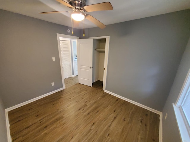 2053 219th Pl, Sauk Village, IL 60411 - unfurnished bedroom with wood finished floors, a closet, and a ceiling fan