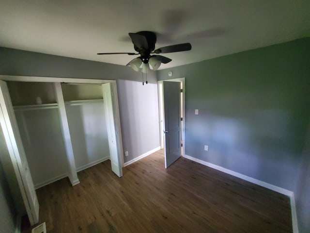 2053 219th Pl, Sauk Village, IL 60411 - unfurnished bedroom featuring dark wood-style flooring, a ceiling fan, and a closet