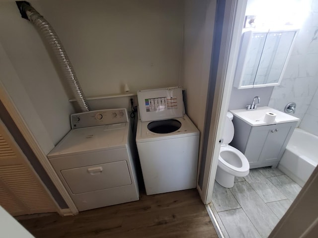 2053 219th Pl, Sauk Village, IL 60411 - laundry area with independent washer and dryer and light wood-style floors