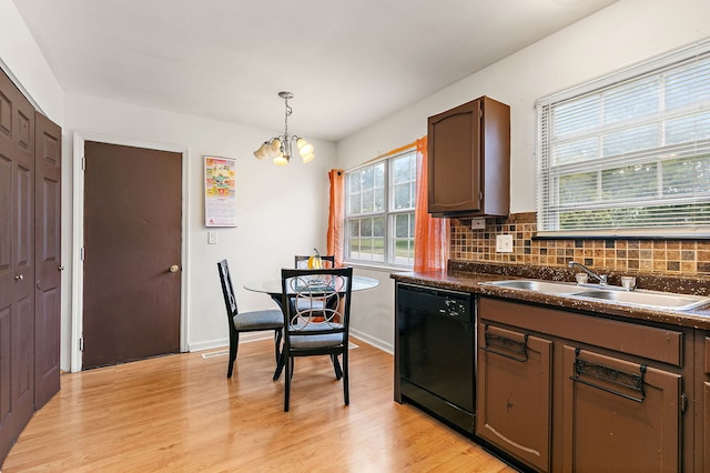 229 Ascot Ln, Streamwood, IL 60107 - kitchen with dishwasher, a chandelier, plenty of natural light, and light wood-type flooring