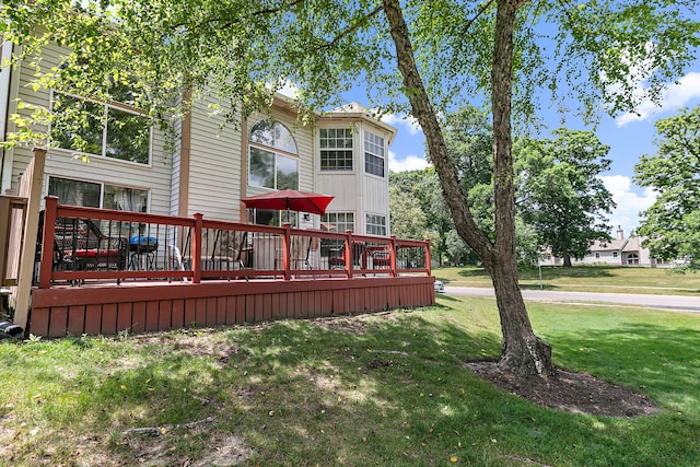 229 Ascot Ln, Streamwood, IL 60107 - rear view of house featuring a deck and a lawn