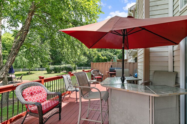 229 Ascot Ln, Streamwood, IL 60107 - wooden deck featuring a fenced backyard and outdoor dining area