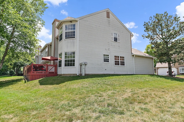 229 Ascot Ln, Streamwood, IL 60107 - back of property with a wooden deck, a lawn, and a chimney