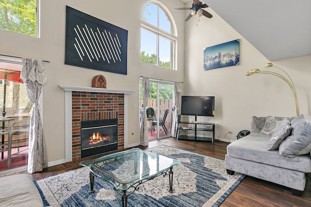 229 Ascot Ln, Streamwood, IL 60107 - living room with a high ceiling, a ceiling fan, plenty of natural light, a fireplace, and wood finished floors