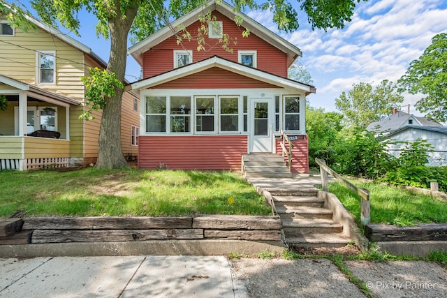 2213 Elm St, Rockford, IL 61102 - view of front of house featuring entry steps and a front lawn