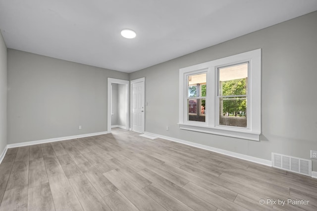 2213 Elm St, Rockford, IL 61102 - empty room featuring light wood-type flooring and baseboards