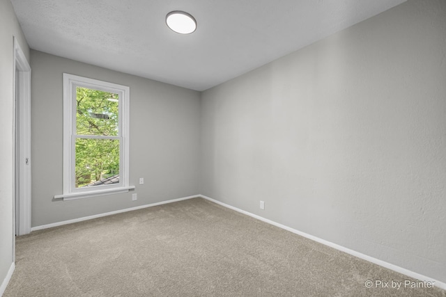 2213 Elm St, Rockford, IL 61102 - carpeted empty room with baseboards