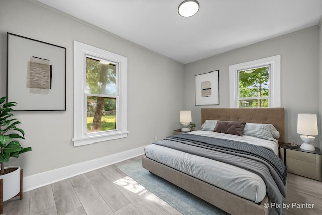 2213 Elm St, Rockford, IL 61102 - bedroom with multiple windows and wood finished floors