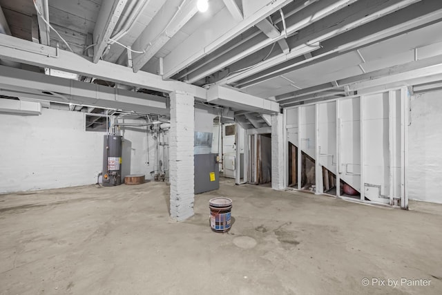 2213 Elm St, Rockford, IL 61102 - unfinished basement featuring gas water heater and washer / dryer