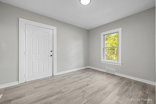 2213 Elm St, Rockford, IL 61102 - empty room featuring light wood-style floors and baseboards