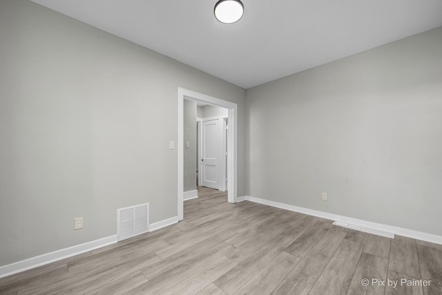 2213 Elm St, Rockford, IL 61102 - empty room featuring wood finished floors and baseboards