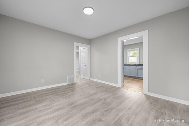 2213 Elm St, Rockford, IL 61102 - unfurnished room with light wood finished floors and baseboards