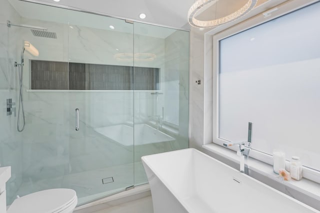 4944 Jarvis Ave, Skokie, IL 60077 - full bathroom with a marble finish shower and a soaking tub