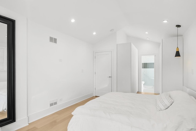 4944 Jarvis Ave, Skokie, IL 60077 - bedroom featuring light wood finished floors, lofted ceiling, recessed lighting, and connected bathroom