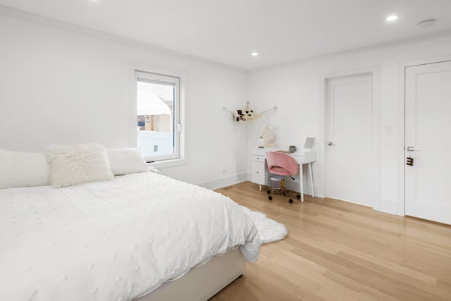 4944 Jarvis Ave, Skokie, IL 60077 - bedroom with light wood-style flooring, recessed lighting, and an office area