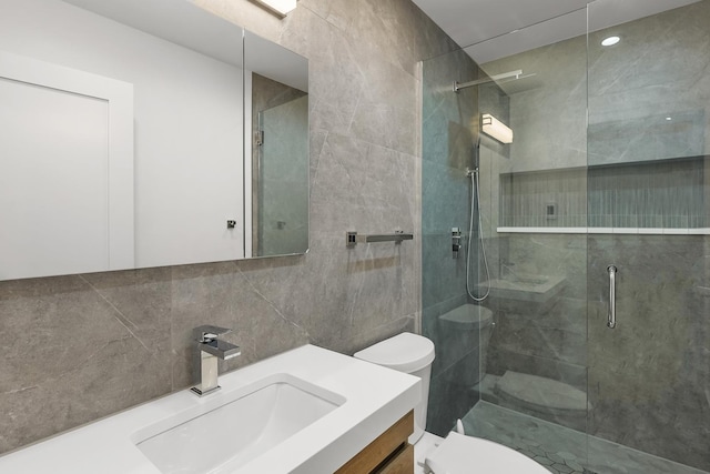 4944 Jarvis Ave, Skokie, IL 60077 - bathroom featuring an enclosed shower, vanity, tile walls, and tasteful backsplash