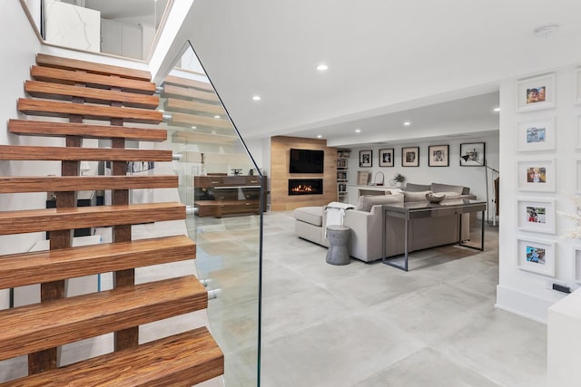 4944 Jarvis Ave, Skokie, IL 60077 - living area with stairs, a large fireplace, recessed lighting, and concrete flooring