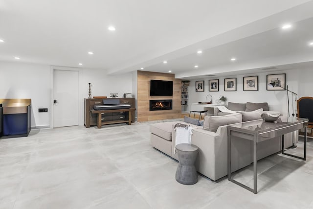 4944 Jarvis Ave, Skokie, IL 60077 - living room featuring recessed lighting, a large fireplace, and concrete floors