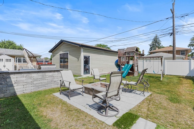 4944 Jarvis Ave, Skokie, IL 60077 - view of yard with a playground, a patio area, a fire pit, and an outbuilding