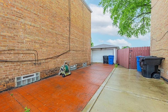 5228 W 54th St, Chicago, IL 60638 - view of patio with a garage, driveway, and an outdoor structure