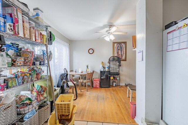 5228 W 54th St, Chicago, IL 60638 - dining space with a heating unit, ceiling fan, and wood finished floors
