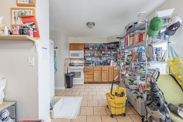 5228 W 54th St, Chicago, IL 60638 - kitchen with white appliances, open shelves, and light tile patterned flooring