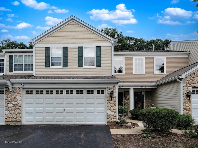 2517 Oak Tree Ln, Plainfield, IL 60586 - view of front facade with stone siding, asphalt driveway, and a garage