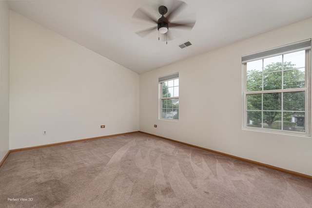 2517 Oak Tree Ln, Plainfield, IL 60586 - unfurnished room featuring light colored carpet, lofted ceiling, and a ceiling fan