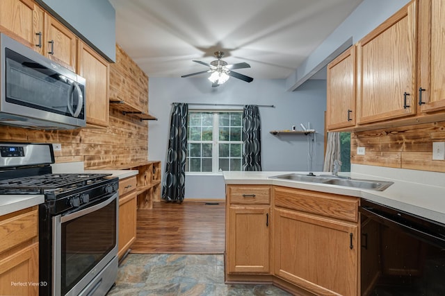 2517 Oak Tree Ln, Plainfield, IL 60586 - kitchen with stainless steel appliances, tasteful backsplash, a ceiling fan, a peninsula, and light countertops
